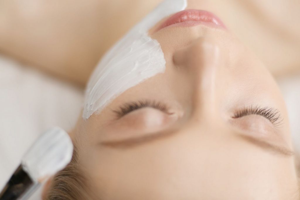 Woman receiving a chemical peel