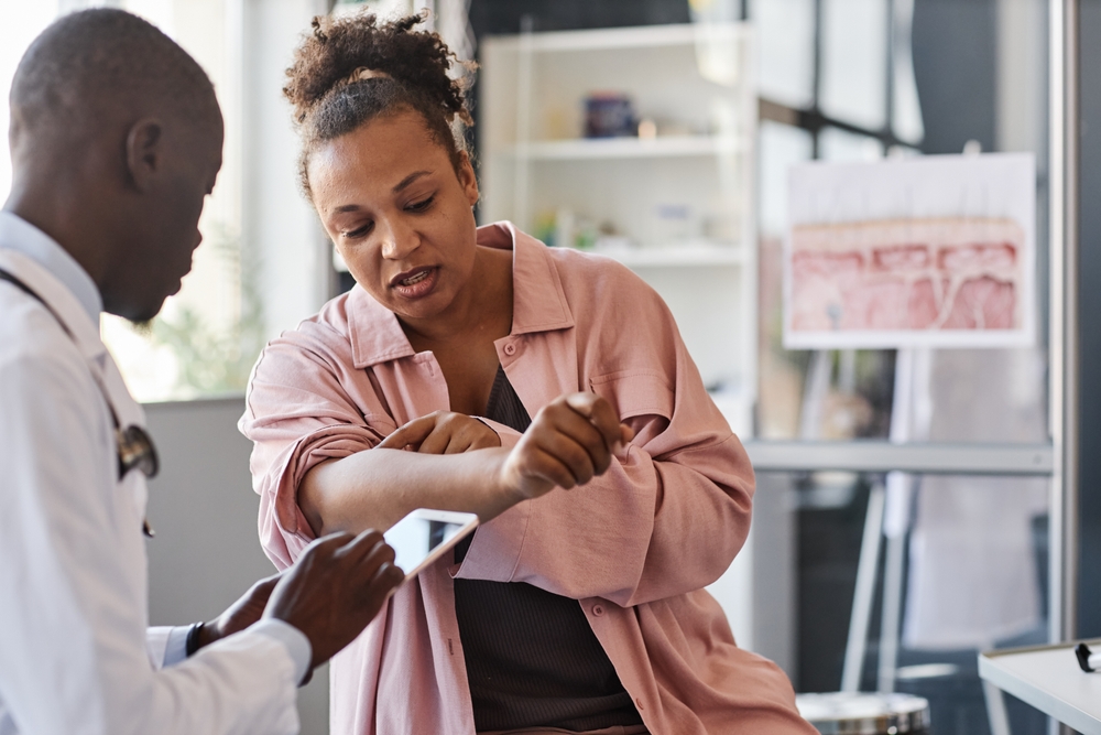 A man reviewing information on paper with a woman